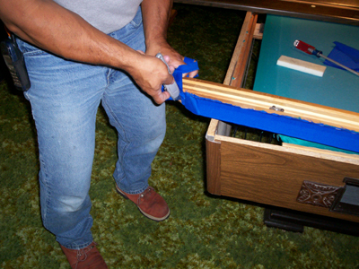 removing the excess felt from the pool table rails